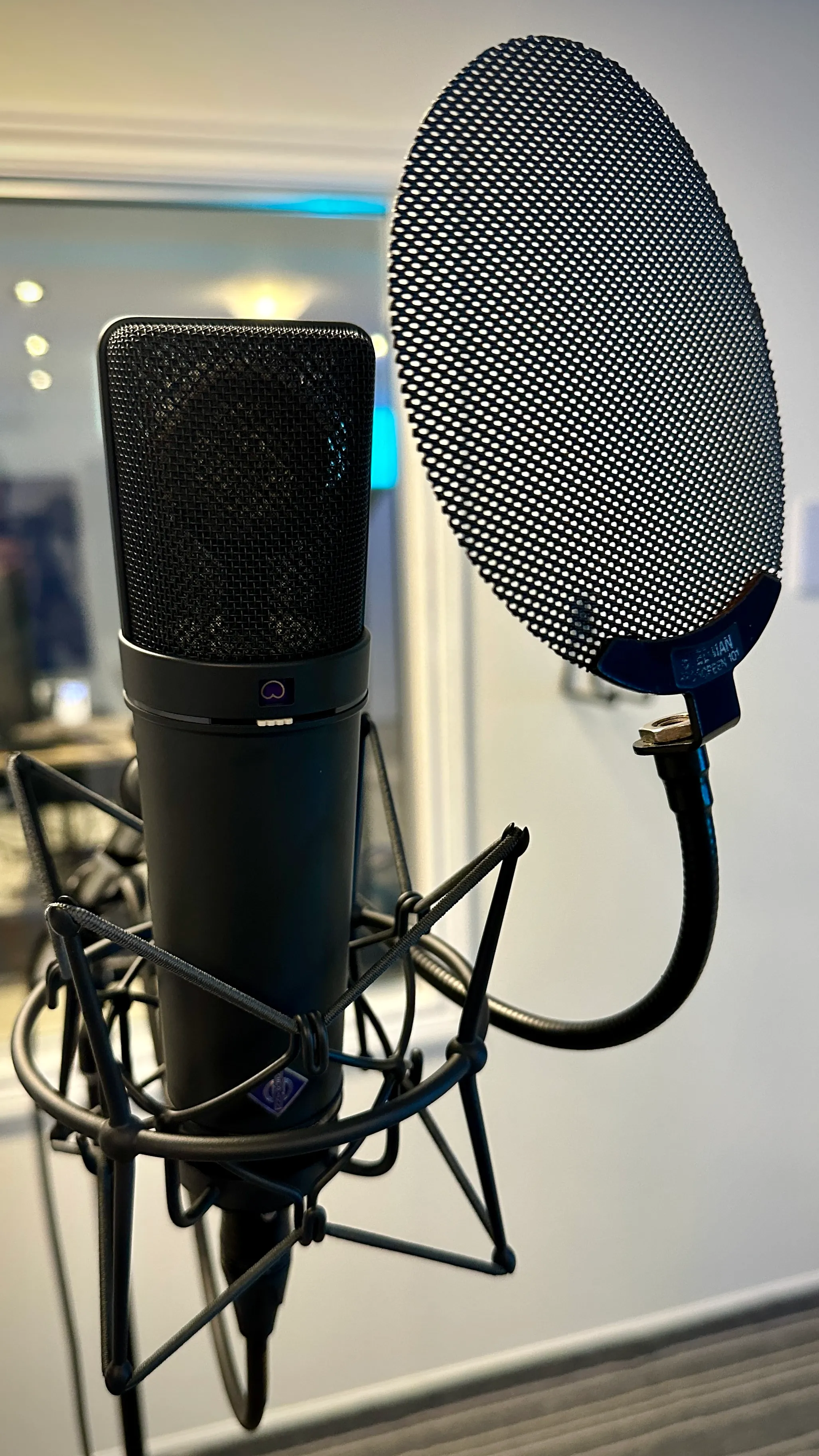The Fly Away Neumann U 87 Ai on its shock mount and pop filter in the studio