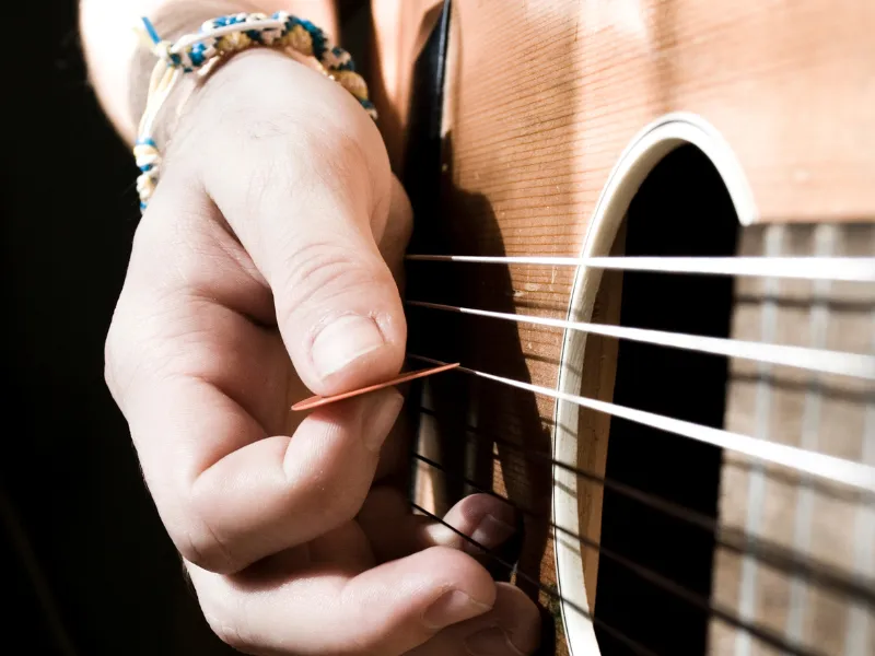 A Quick Guide On How To Strum A Guitar Like A Pro! (2023)
