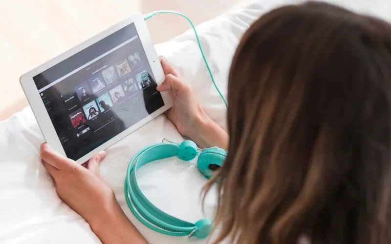 Streaming music online (Spotify, Apple Music, and Tidal streaming services)